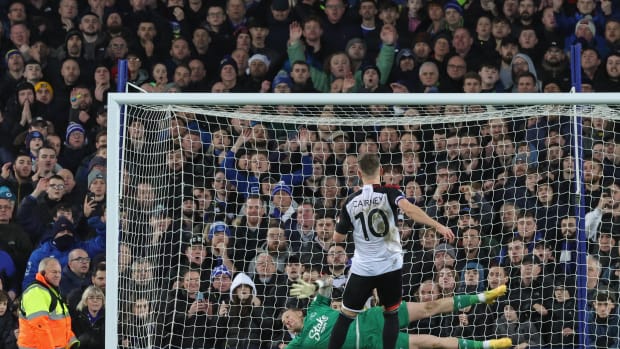 Fulham's Tom Cairney pictured narrowly beating Everton goalkeeper Jordan Pickford during a penalty shootout in the quarter-finals of the EFL Cup in December 2023